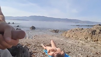 Young Man Exposes Himself To A Nude Middle-Aged Woman On The Beach